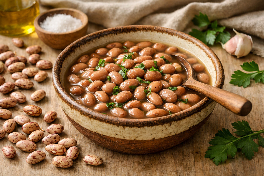 Carioca Beans — freshly cooked in a rustic bowl with raw speckled beans on a wooden table