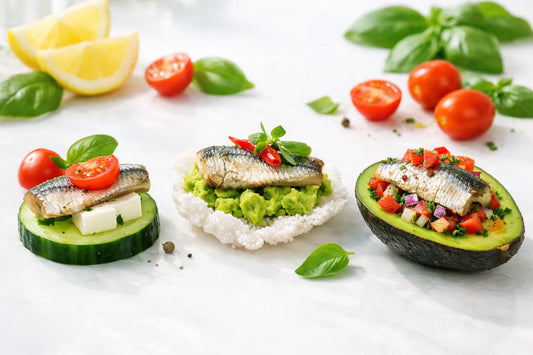 Sardine Snack Bites — Three types of high-protein snacks on cucumber, a cracker, and in an avocado boat.