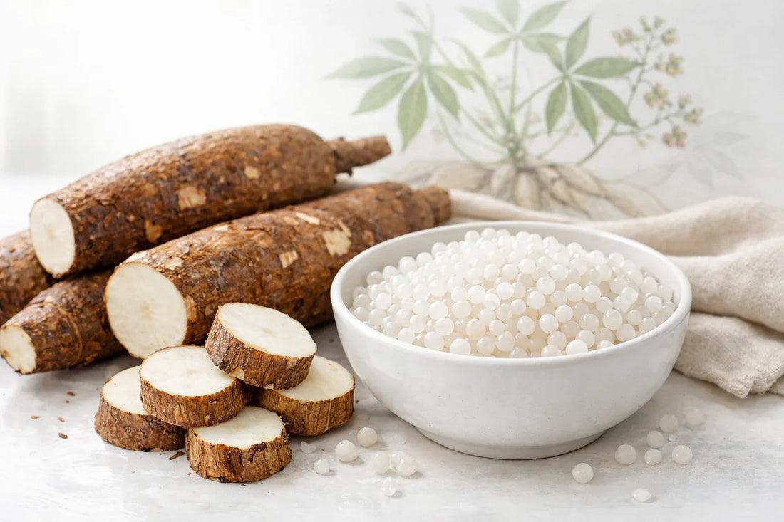 Cassava tapioca — raw cassava roots and translucent tapioca pearls in a white bowl