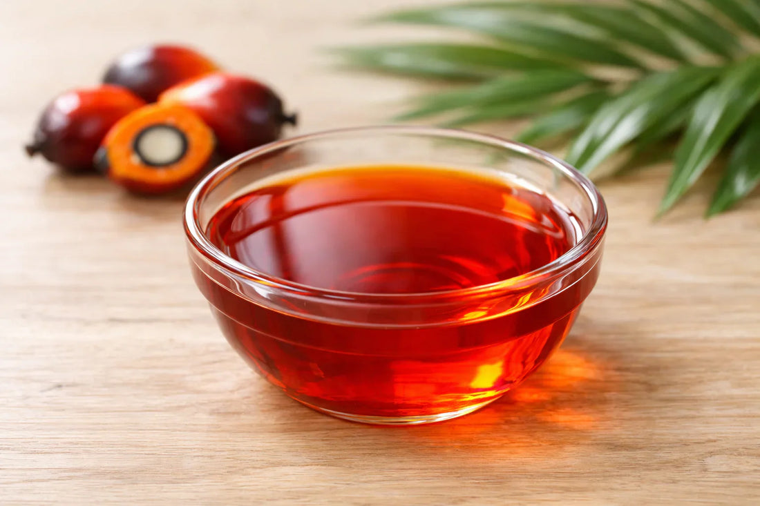 Red Palm Oil — vibrant red palm oil in a glass bowl with palm fruits