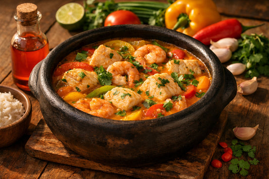 Moqueca de Peixe — an authentic Bahian fish stew served in a traditional clay pot on a rustic table.