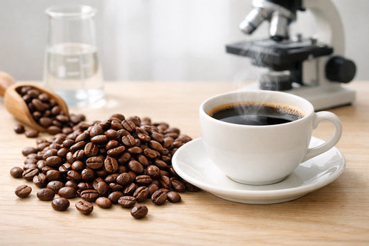 Arabica Coffee — freshly roasted beans and a steaming cup on a clean wooden surface, highlighting health benefits.