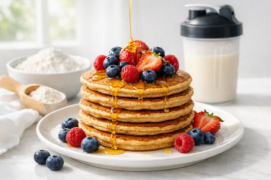 Proteïne pannenkoeken — a stack of gluten-free pancakes made with tapioca, topped with fresh berries.