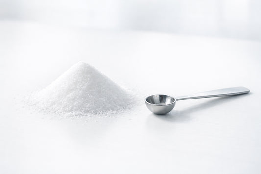 Iodized Table Salt — a small pile of fine white salt with a measuring spoon on a clean surface