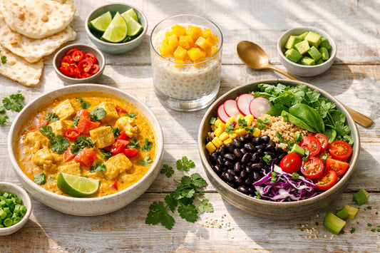 Vegan recepten — a vibrant flat lay of several plant-based dishes including a creamy coconut curry and a colorful rice bowl.
